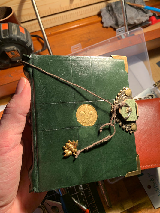 Veggie tanned dark green leather saints journal with unique clasp and medieval border design 400 pages fine paper