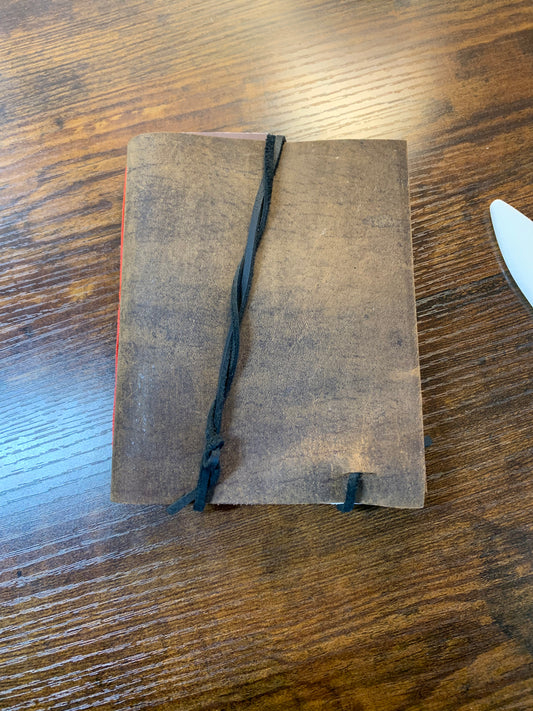 Simple Buffalo Leather travel journal red thread - Now on display at the Ferry County Food Co-op in Republic, WA!