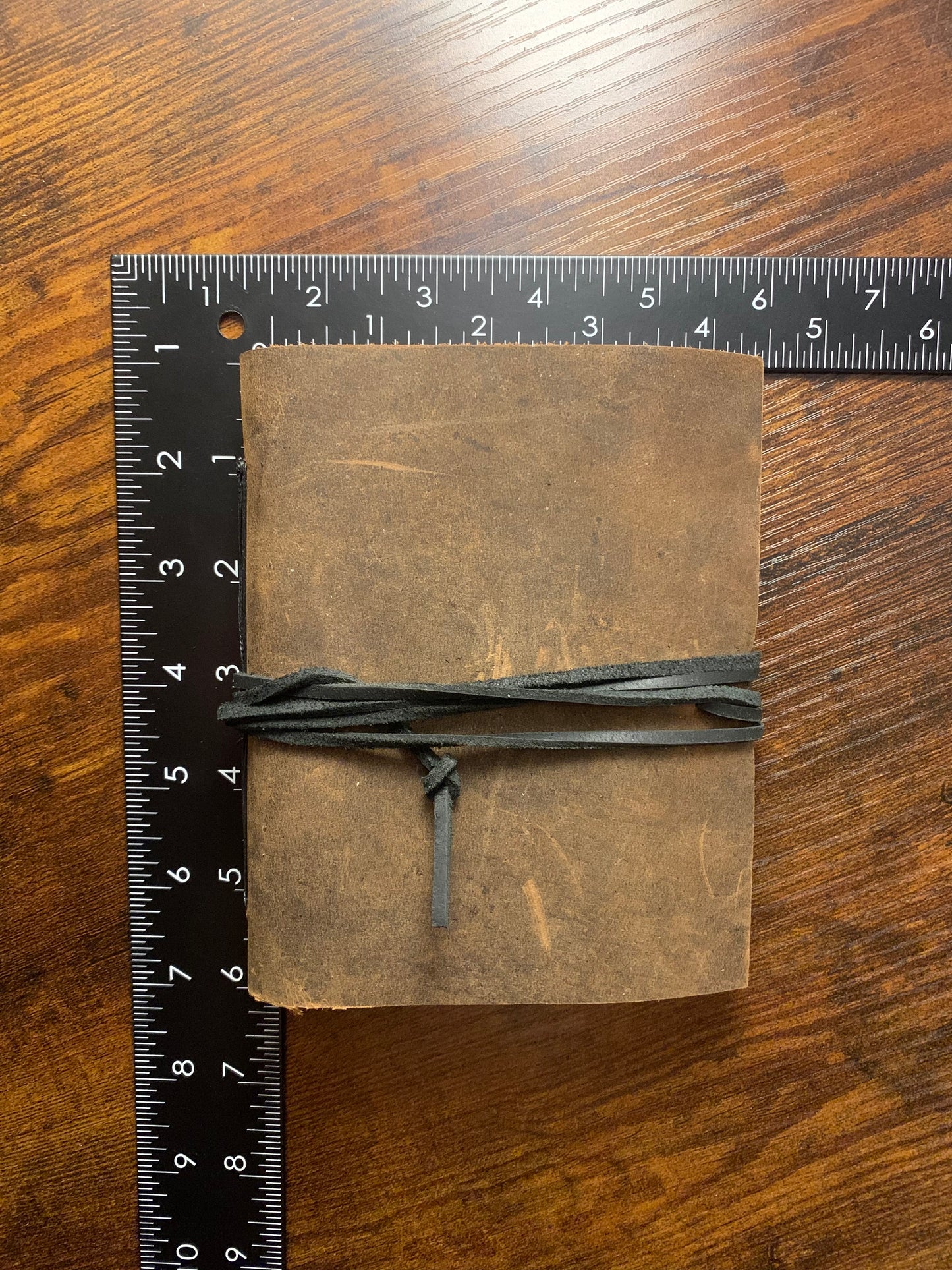 Simple Buffalo Leather Travel Journal gray thread, now on display at the Ferry County Food Co-op in Republic, WA!